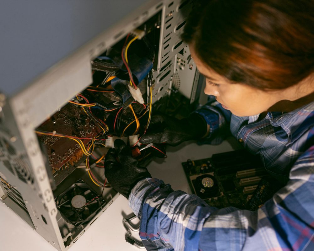 A female computer professional installing bus topology in an office  